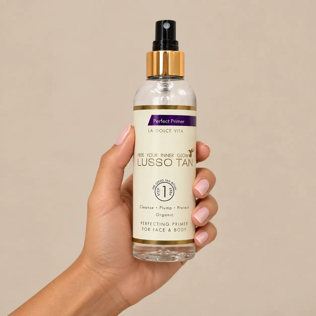 Lusso Tan Perfect Primer 200ml pH balancing face and body spray held in hand
